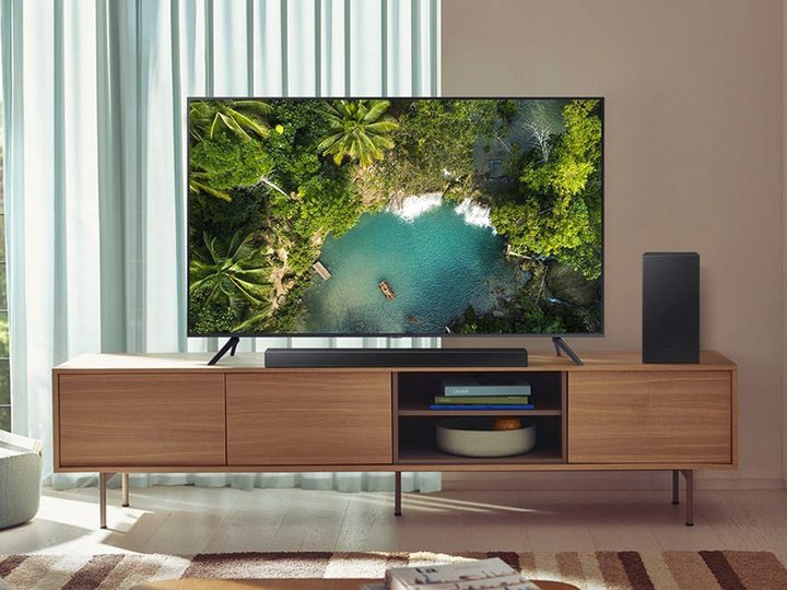 The Samsung 2.1-channel soundbar and included subwoofer set on a media cabinet.