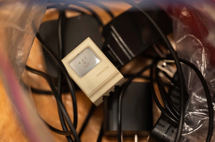 The Shargeek Retro 35W charger in a bag full of generic chargers.