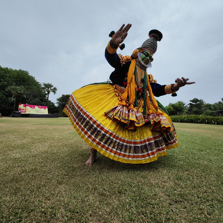 Classical Indian Kathakali dancer on grass captured with the Xiaomi 12S Ultra.