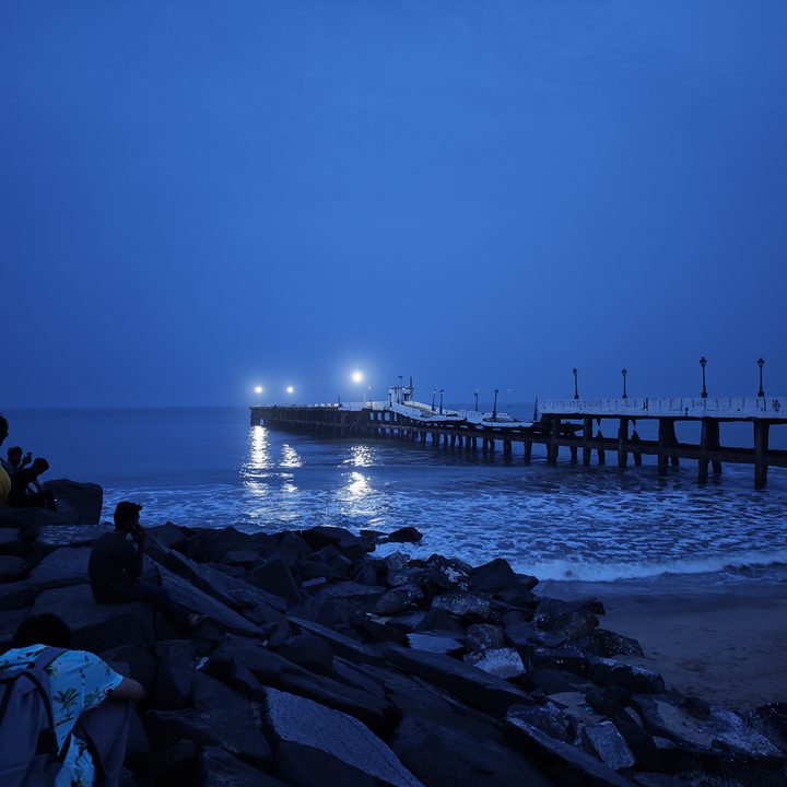 Sea beach and pier at night captured with the Xiaomi 12S Ultra.