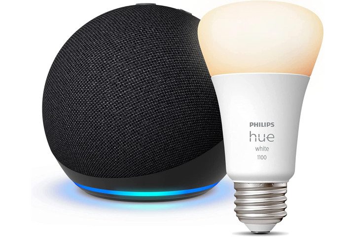 A Charcoal Amazon Echo Dot 5th Gen smart speaker with a Philips Hue Smart Bulb alongside.