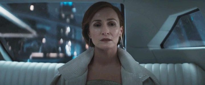 A woman looks at the camera in Andor.