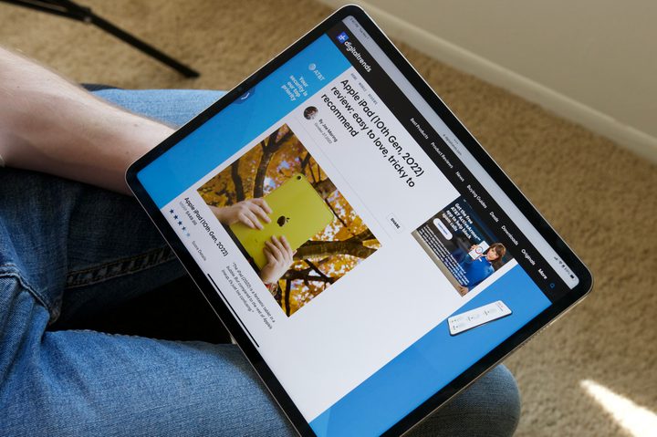 Reading an article from Digital Trends on the iPad Pro (2022).