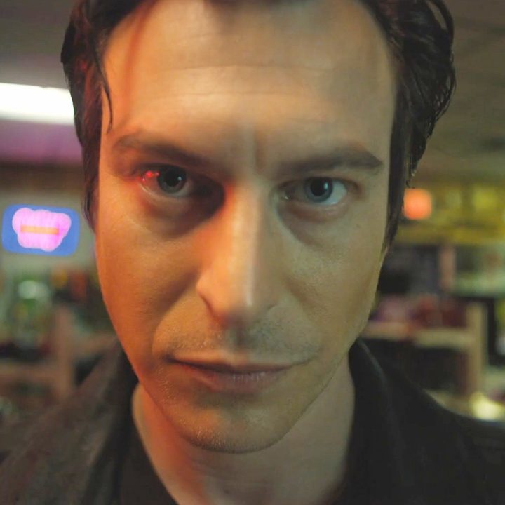 A man looks into a camera in Blood Relatives.