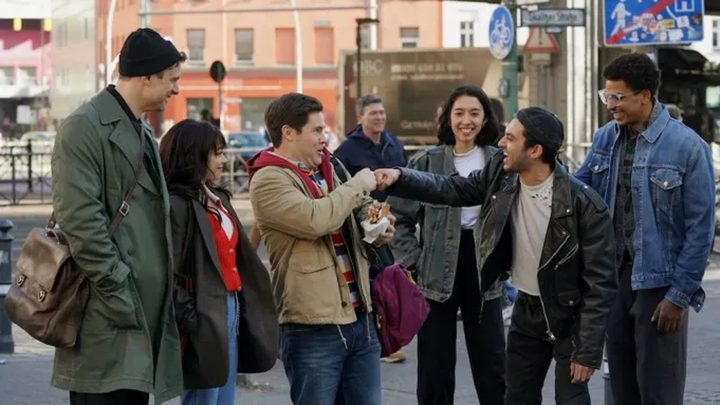 Two guys fist bump in Pitch Perfect: Bumper in Berlin.