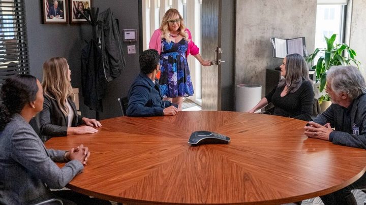 A woman enters a crowded room in Criminal Minds: Evolution.