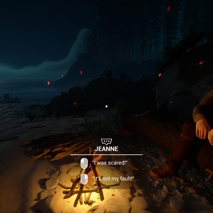 A man sits next to a campfire in the canadian wilderness in Two Falls.