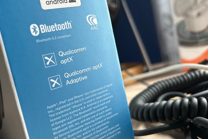 Headphone box displaying aptX Adaptive logo.