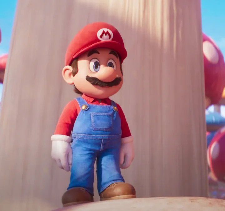 Mario stands on a mushroom in the Super Mario Bros. movie.