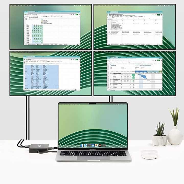 An Apple MacBook with four extra displays added.