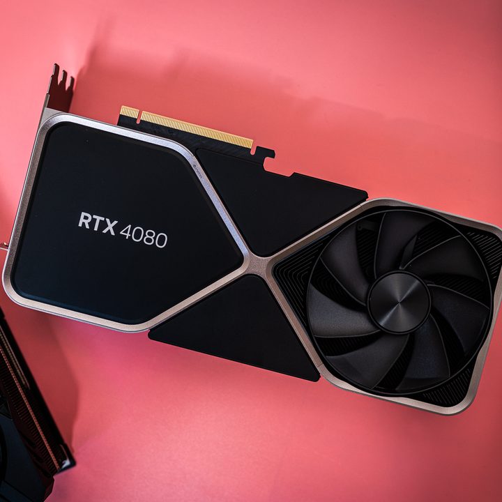 Nvidia GeForce RTX 4080 lays on a pink surface.