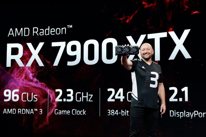 Scott Herkalman holding the RX 7900 XTX graphics card.