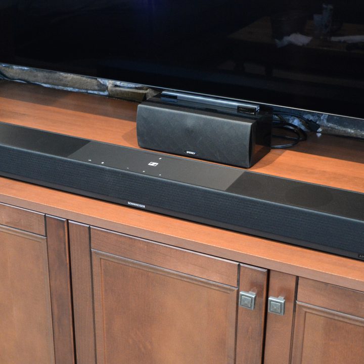 In front of TV: Sennheiser Ambeo Soundbar Plus.