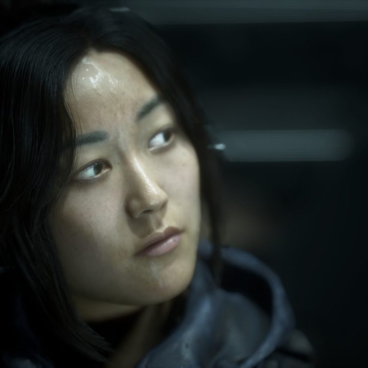 A female character stares off to the side in The Callisto Protocol.