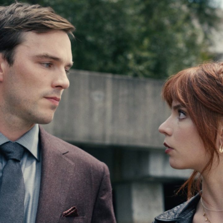 A man and a woman look at each other outside in "The Menu."