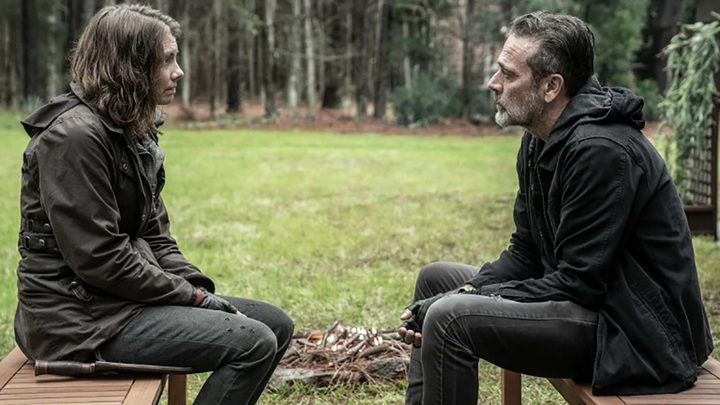 Maggie and Negan sit face-to-face in a scene from The Walking Dead.