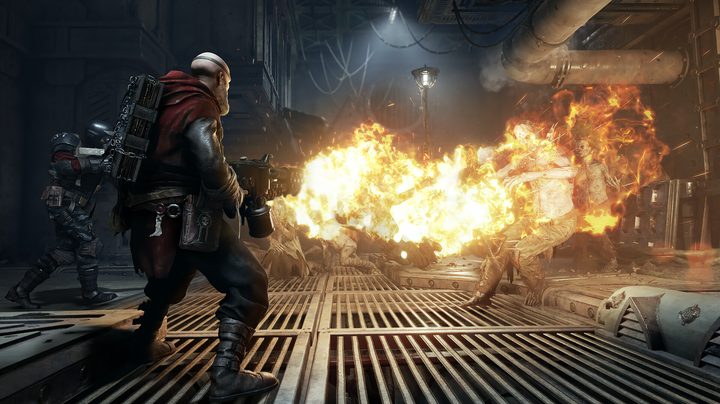 A reject using a flamethrower in Warhammer 40K Darktide.