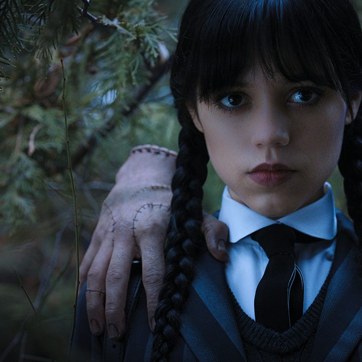 Wednesday Addams with Thing on her shoulder in "Wednesday."