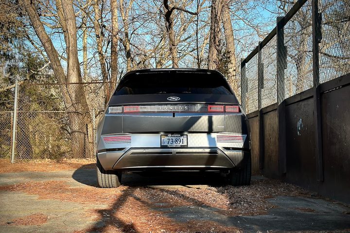 2022 Hyundai Ioniq 5 Limited AWD close up of rear end with trees in the back.