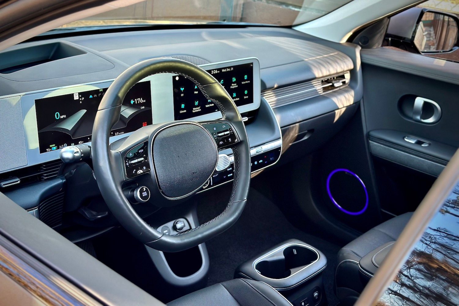 Close up of steering wheel in 2022 Hyundai Ioniq 5 Limited AWD during sunset.