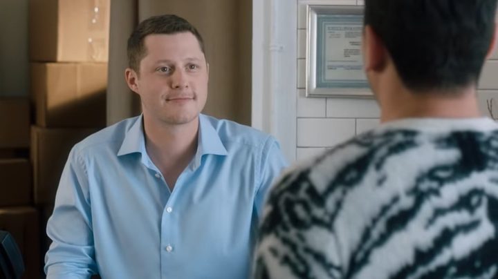 Patrick smiling at David in "Schitt's Creek."