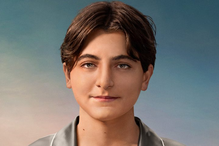 A de-aged Joaquin Phoenix smiles on the poster for Beau is Afraid.