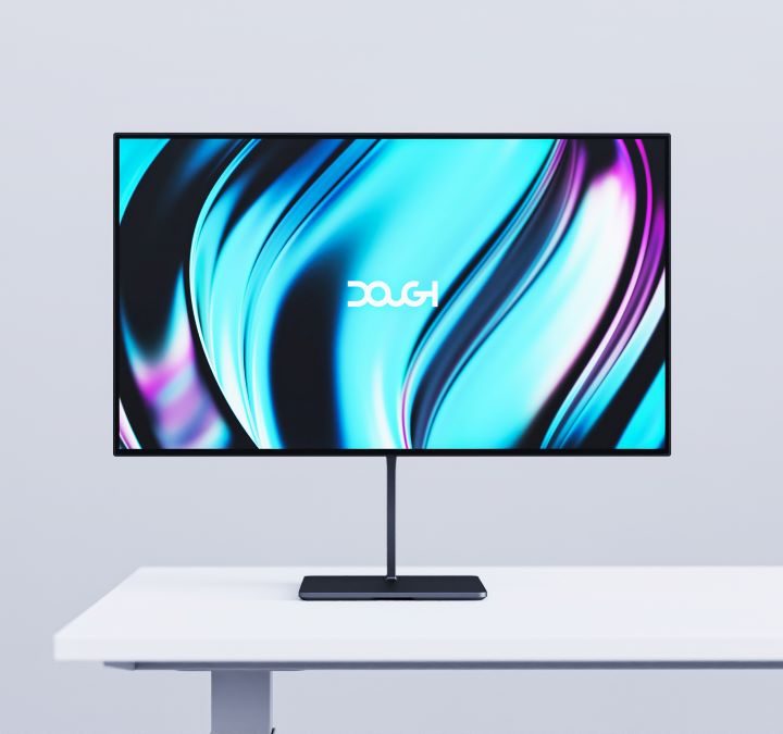 The new Dough Glossy OLED Gaming Monitor on a white table.