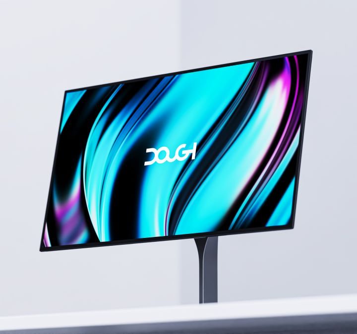 The Dough OLED Spectrum gaming monitor at an angle on a white table.