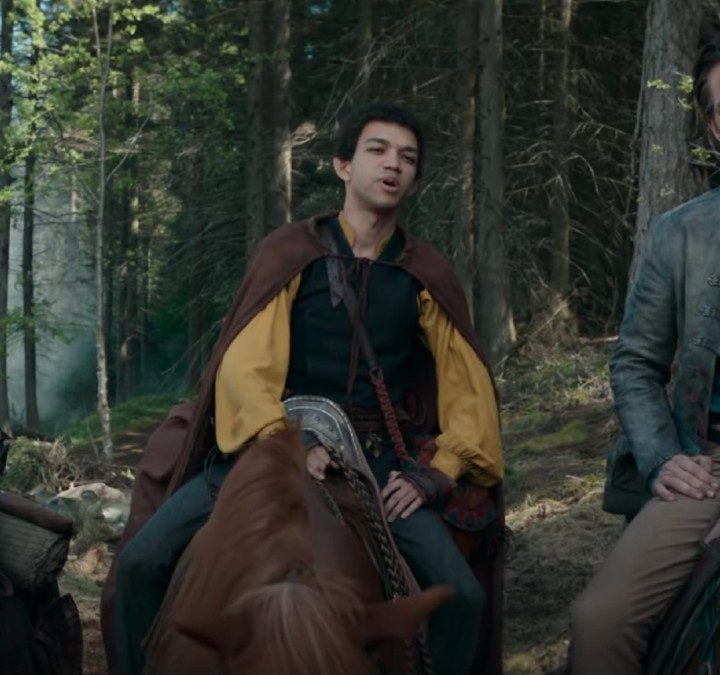 Three people sit on horses and stare in a scene from Dungeons & Dragons.