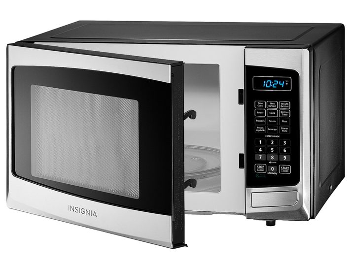 The Insignia 0.9 Cu. Ft. Compact Microwave on a white background with its door opened.
