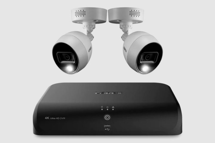 Two Lorex security cameras with a black control box.