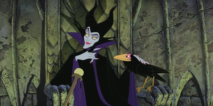 Malificent pets her crow in Sleeping Beauty