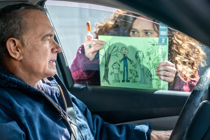 Mariana Treviño shows a drawing to Tom Hanks in A Man Called Otto.