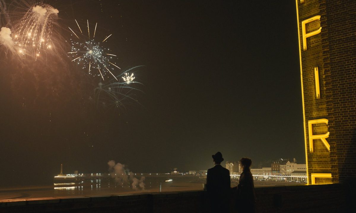 Micheal Ward and Olivia Colman look up at fireworks in Empire of Light.