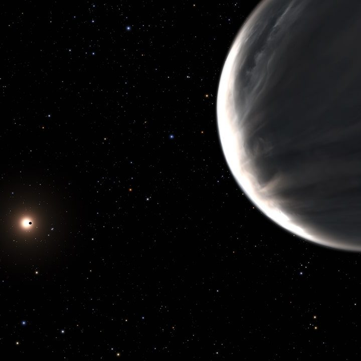 In this illustration super-Earth Kepler-138 d is in the foreground. To the left, the planet Kepler-138 c, and in the background the planet Kepler 138 b, seen in silhouette transiting its central star.