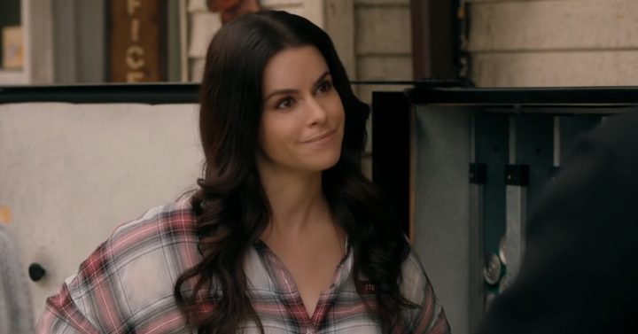 Stevie smiling at David in "Schitt's Creek."
