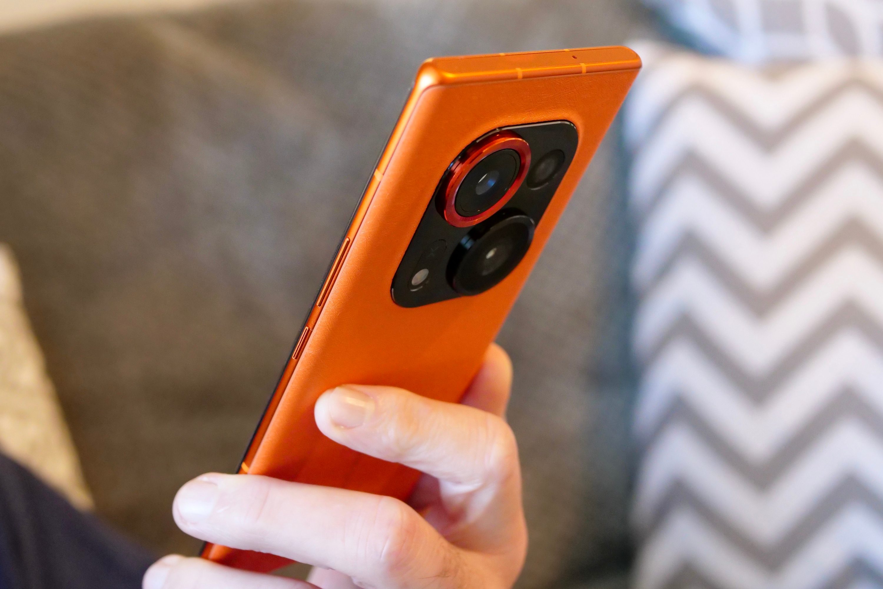 The Tecno Phantom X2 Pro held in a person's hand.