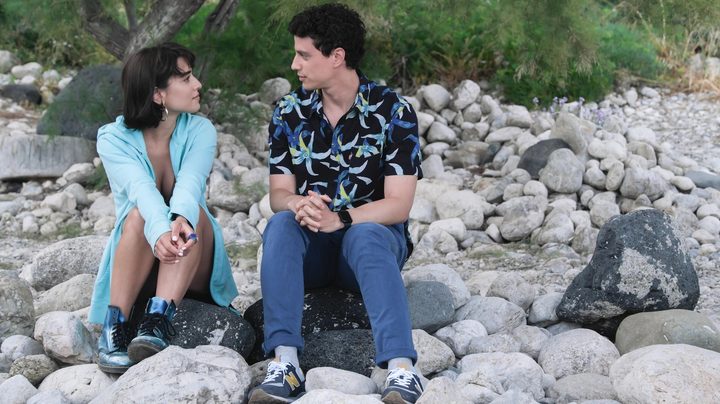 Lucia and Albie talk in The White Lotus.