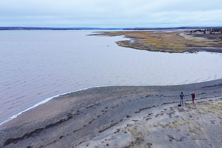 This is a still frame from a video of an ocean view captured by the DJI Mini 3 on a windy, overcast day.