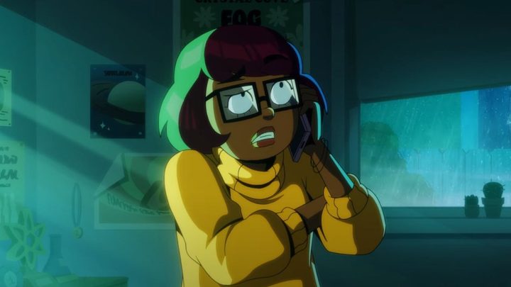 Velma looking scared while on the phone in HBO Max's Velma.