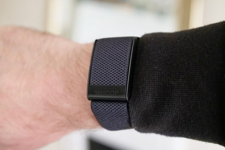 The front of the Whoop 4.0 on a person's wrist.