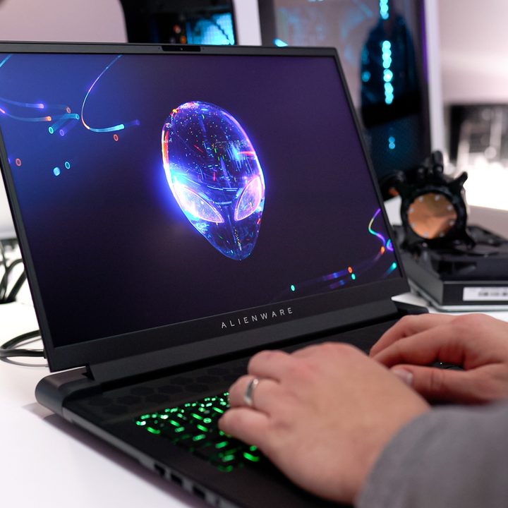 Someone typing on the Alienware m18 laptop.