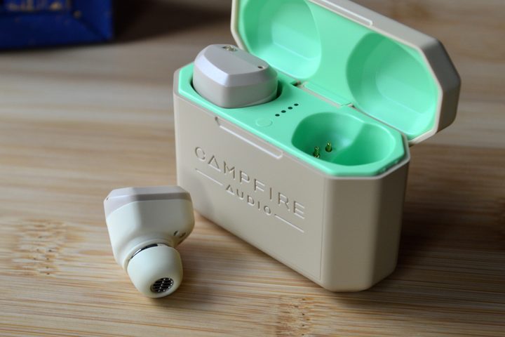 Campfire Audio Orbit charging case, lid open, right earbud removed.