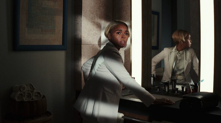 Janelle Monae looks suspicious in Glass Onion.