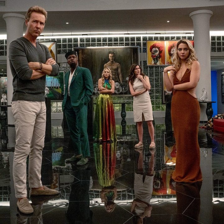 A group of people look suspicious in Glass Onion.