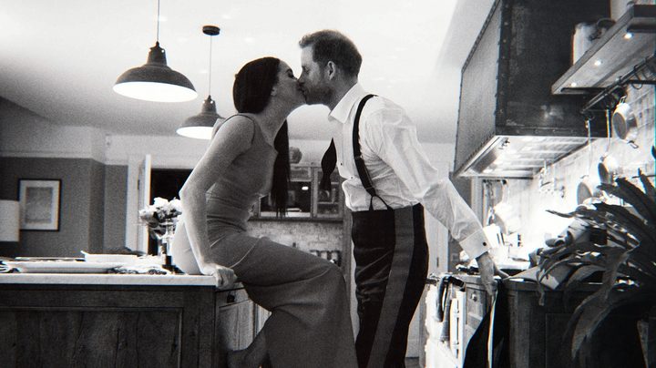 Prince Harry kisses Meghan Markle in Harry & Meghan.