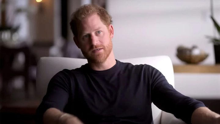 Harry sitting down talking in an interview on Harry & Meghan.