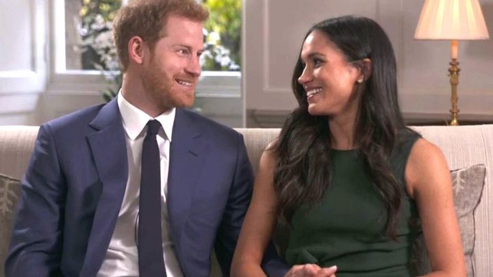 Harry and Meghan sitting on a couch for their Kensington Palace interview.