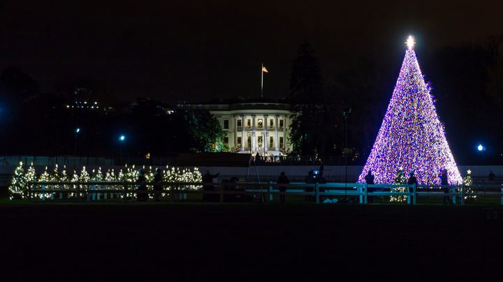 A Christmas tree stands next to the White House in the 2022 National Christmas Tree Lighting Ceremony.