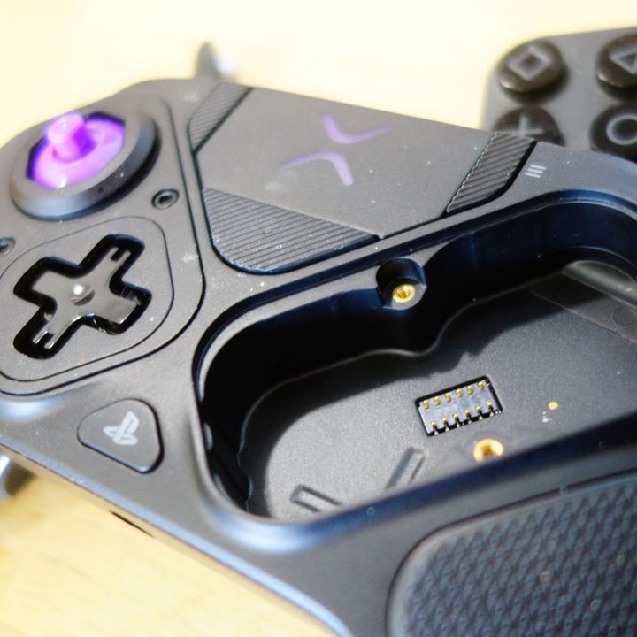 The Victrix Pro BFG controller sits on a table with parts popped off.